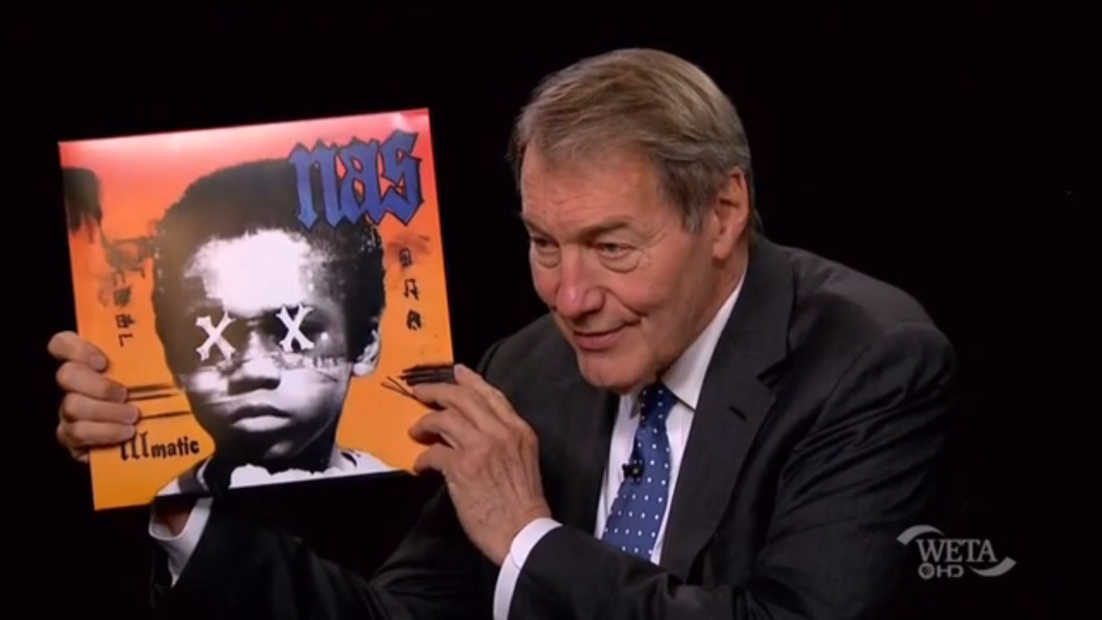 Charlie Hose Holds Illmatic XX while talking to Nas